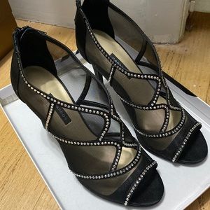 Black with rhinestone size 8 beautiful shoes worn only once.
